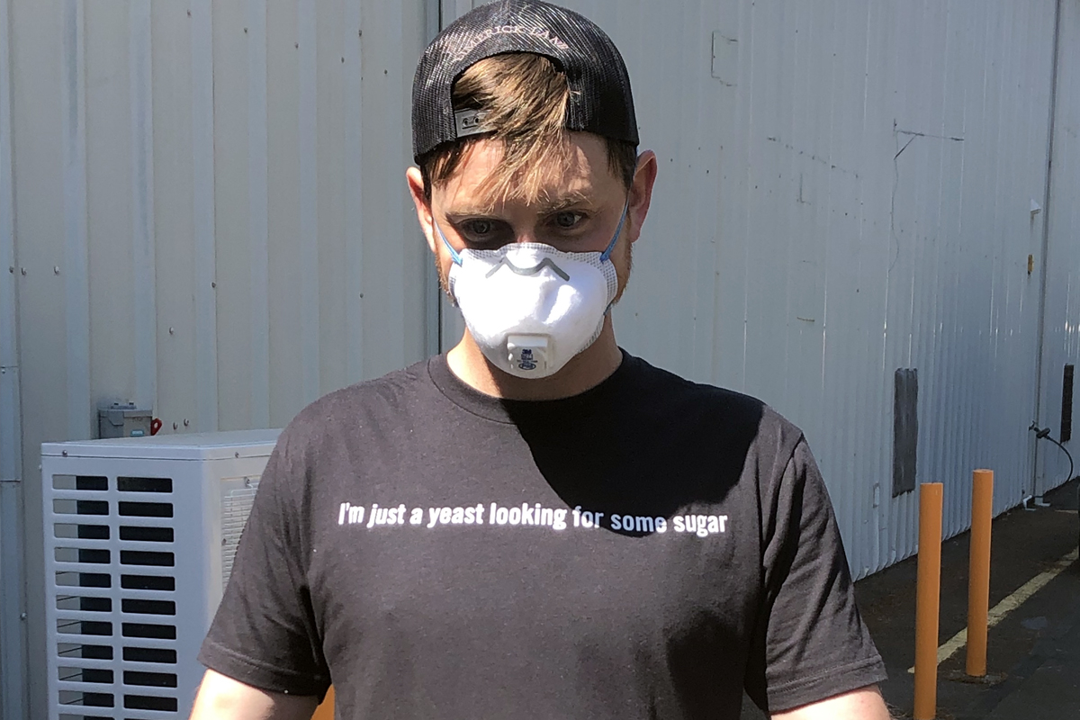 Winery Assistant Seph Scheid wearing a protective face mask at the Bedrock winery